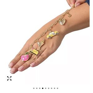 Juicy Couture Gold Charm Bracelet with Pink Heart, Taxi & Cocktail Charms